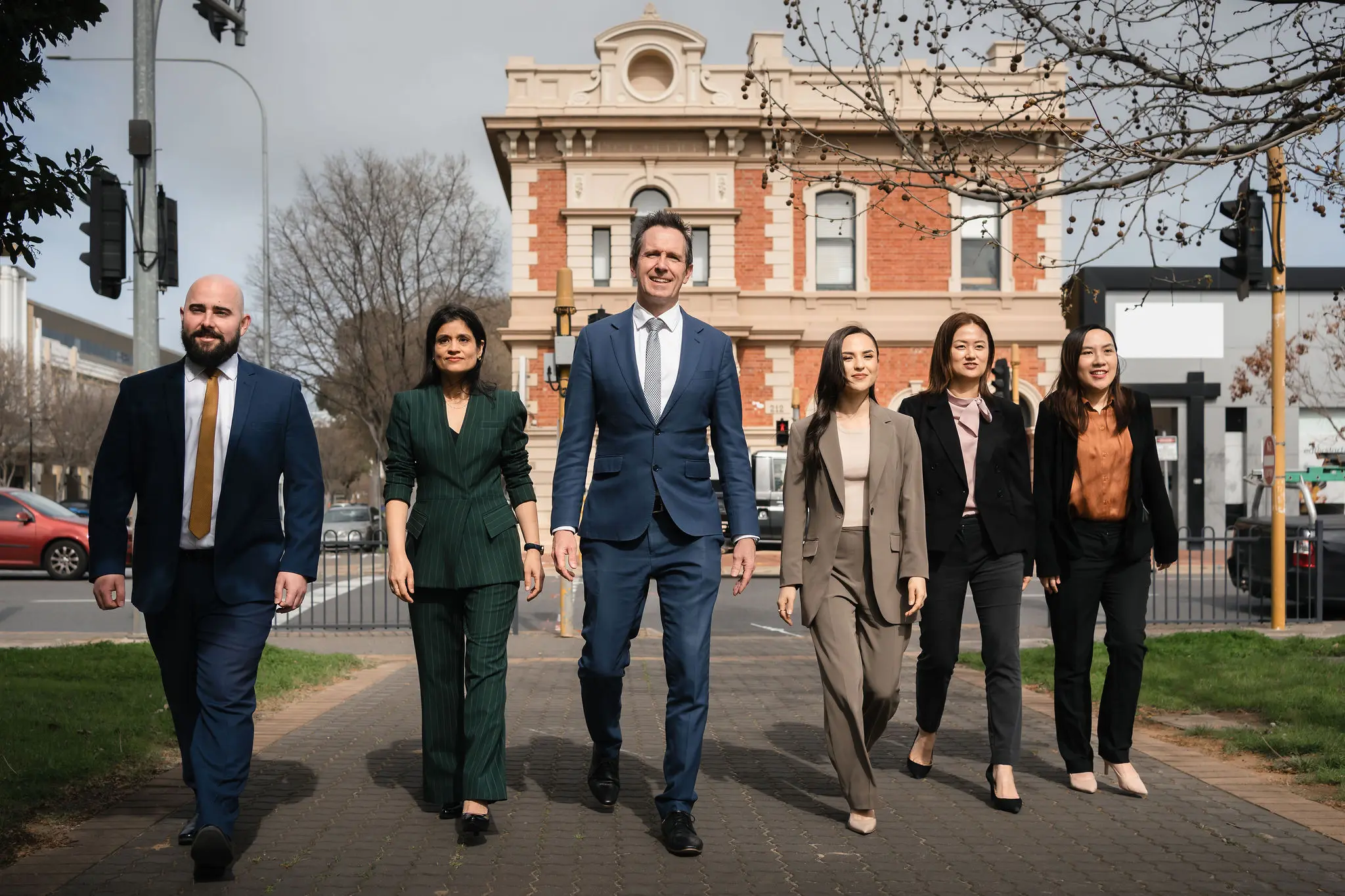 Work Visa Lawyers team walking down a street